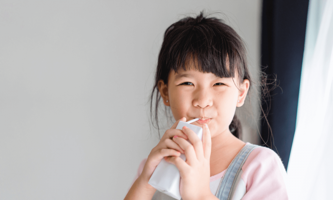 Chinese girl drinking milk